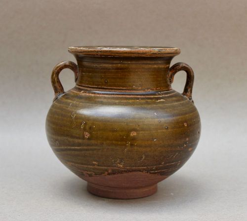 A TANG-FIVE DYNASTY BROWN GLAZED JAR WITH HANDLES
