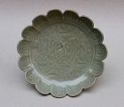 A RARE FLOWER SHAPED CELADON DISH WITH MOLDED INCISED FISHES