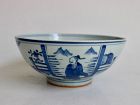 A BLUE AND WHITE LARGE BOWL WITH FIGURES