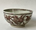 A RARE UNDERGLAZED RED MING DYNASTY BOWL
