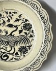 AN EARLY MING BLACK ON YELLOW CREAMY FLOWER SHAPED DISH