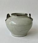 A WHITE GLAZED JAR WITH COPPER RED LIZARD HANDLES