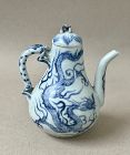 A SMALL BLUE AND WHITE WITH DRAGONS EWER