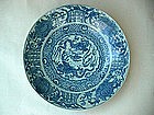 A Large Blue & White Dish With Dragons