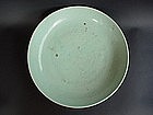 A White Glaze Dish With Incised Flower Scroll Design