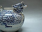 A RARE MUSEUM PIECE DOUBLE HEADED M-DUCK WATER DROPPER