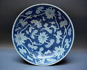 A WHITE ON BLUE KANGXI PERIOD DISH