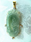 Carved natural jadeite pendant with gold and diamonds