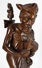 Exceptional Bali Woodcarving: Statue of Man with Cock.