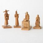 Four Chinese Tushanwan Wood Figurines of Praying Monks, c. 1930.