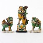 Three Chinese Sancai Biscuit Porcelain Buddhist Lions, Kangxi Period.