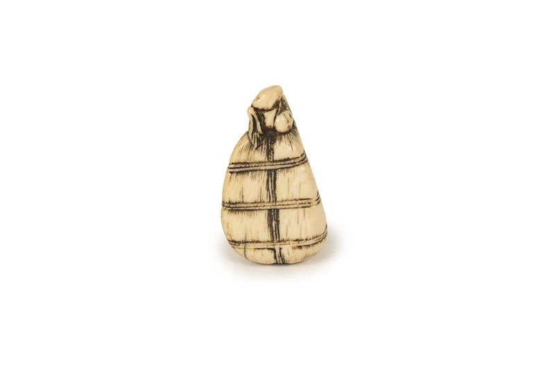 Japanese ivory netsuke representing a bag