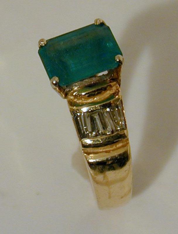 An Emerald And Diamond Ring