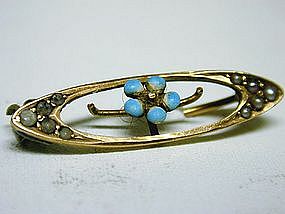 A Vintage Gold And Enamel Oval 
brooch With Flower