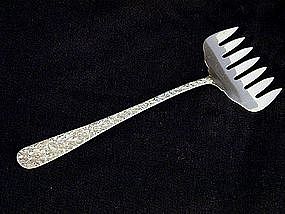 "repousse" Sterling Bacon Fork By Kirk, 
c1925
