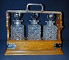 A Victorian Oak and Silverplate Tantalus