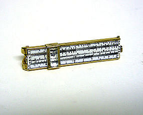 A Slide Rule Tie Clip With Magnifying 
cursor