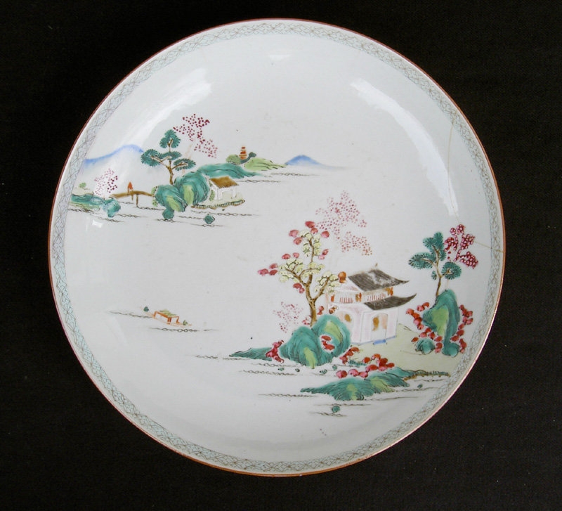 A Chinese landscape bowl or dish in Famille rose enamels