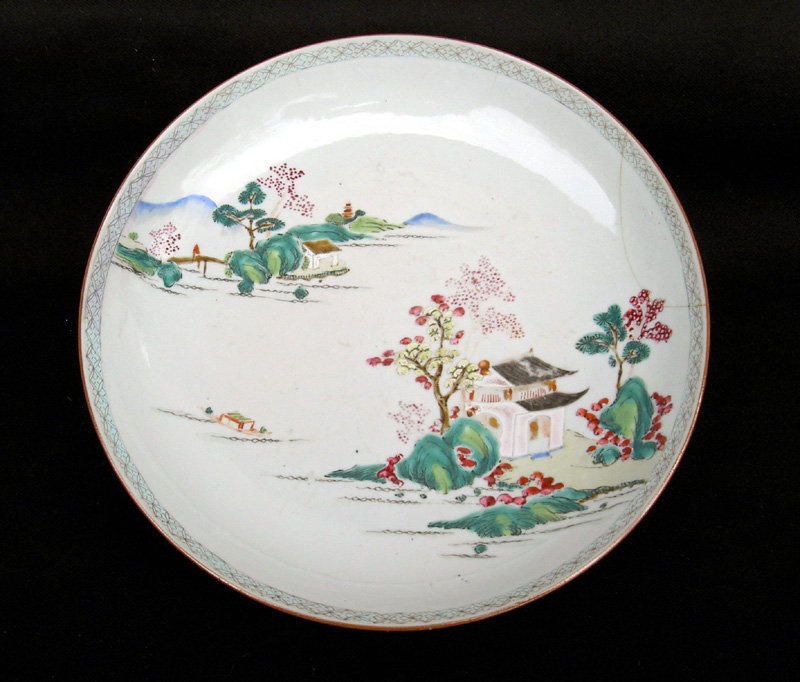 A Chinese landscape bowl or dish in Famille rose enamels