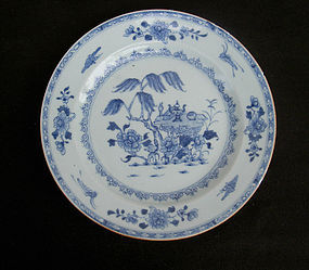 Blue and white Qianlong plate with a laid table