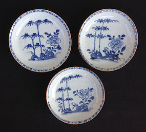Cafe au lait or Batavia ware, three blue & white saucers, 18th century