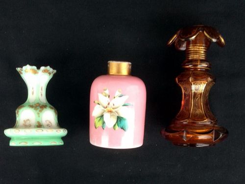 Opaline overlay and gilt perfume bottles