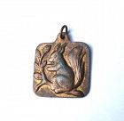 Gilt pewter pendant with a squirrel, by Volmer Bahner, Denmark