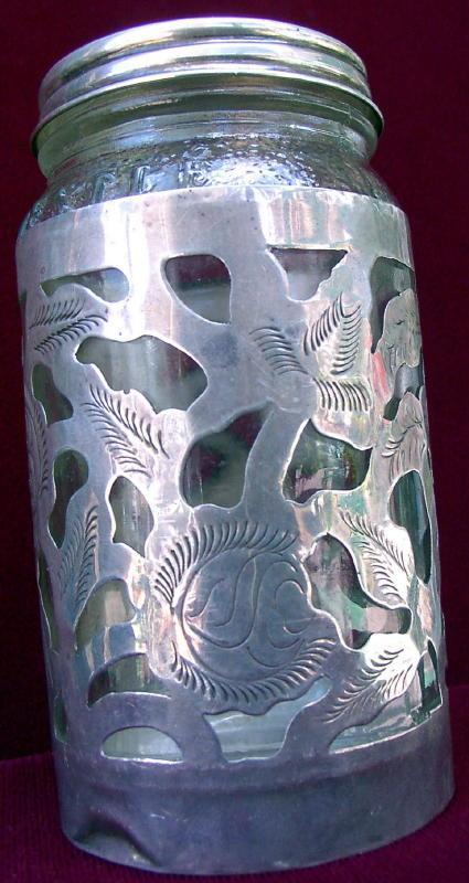 Glass container with silver applique