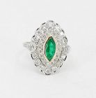 Diamond emerald engagement ring in platinum and 18k gold