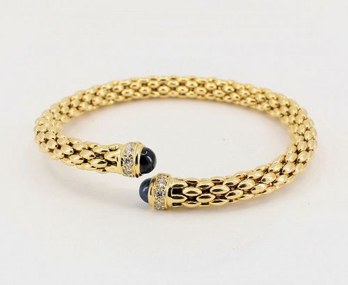 Sapphire diamond flexible bangle bracelet in 18k yellow gold