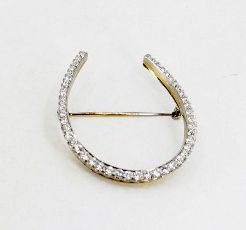Antique diamond horseshoe brooch pin in platinum and 18k gold