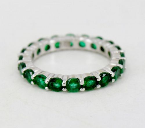 Emerald eternity band ring in 14k white gold