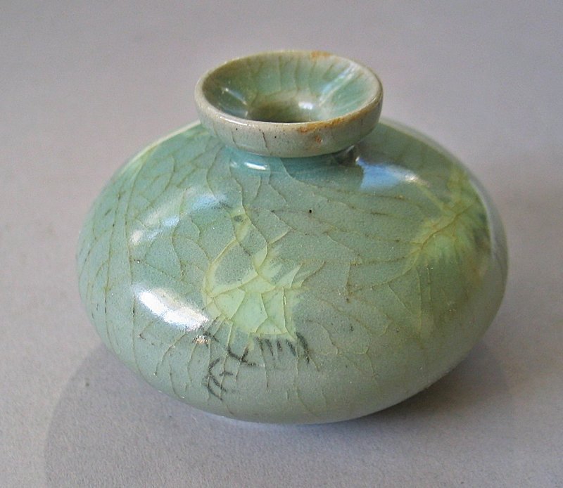 A Very Fine Sea-Green Koryo Celadon Inlaid Oil Bottle