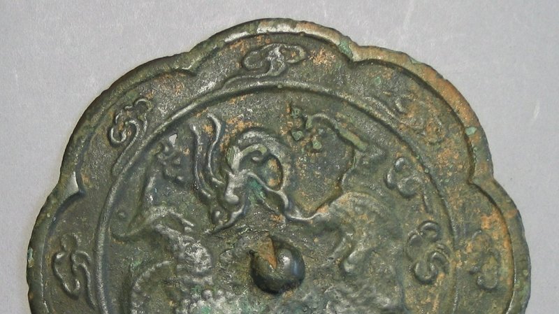 A Rare Koryo Bronze Mirror with a Flying Dragon