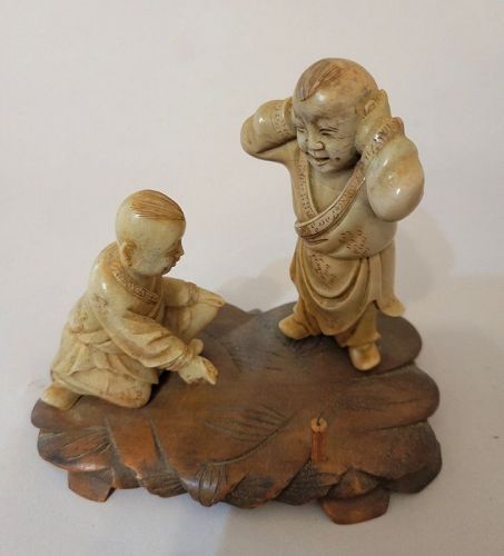 Old Chinese Stone Carving of Boys with Firecracker