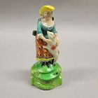 Antique Early Staffordshire figurine woman with dog