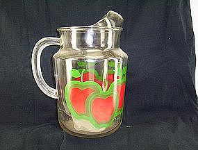 Glass Water pitcher featuring red apples