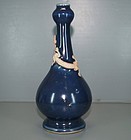 Ming blue glazed vase with biscuit dragon motif