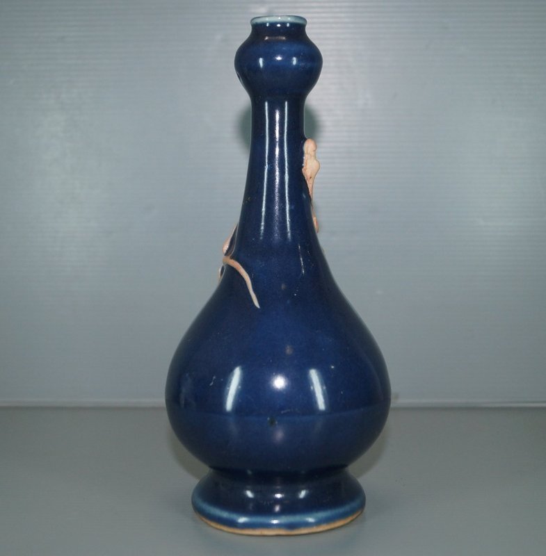 Ming blue glazed vase with biscuit dragon motif