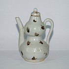 Yuan dynasty iron spotted double gourd ewer with cover