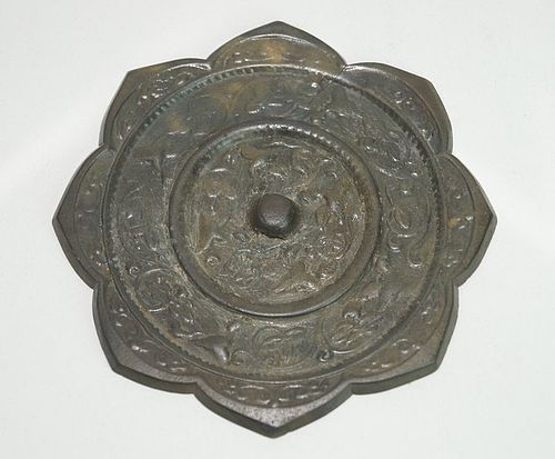 Tang dynasty bronze mirror with animal and flower motif