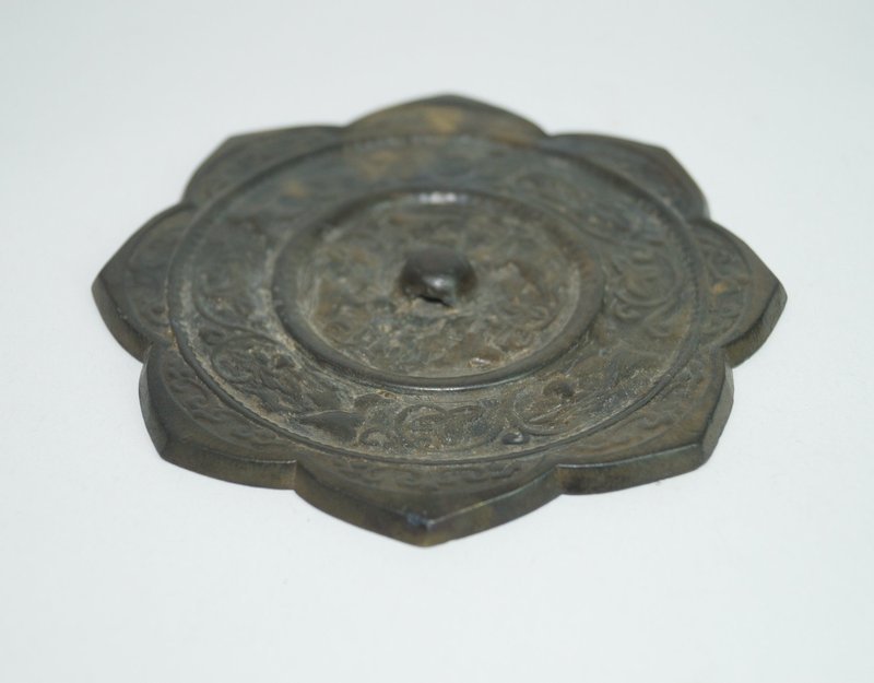 Tang dynasty bronze mirror with animal and flower motif