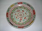 Qing dynasty Kangxi polychrome charger flower motif