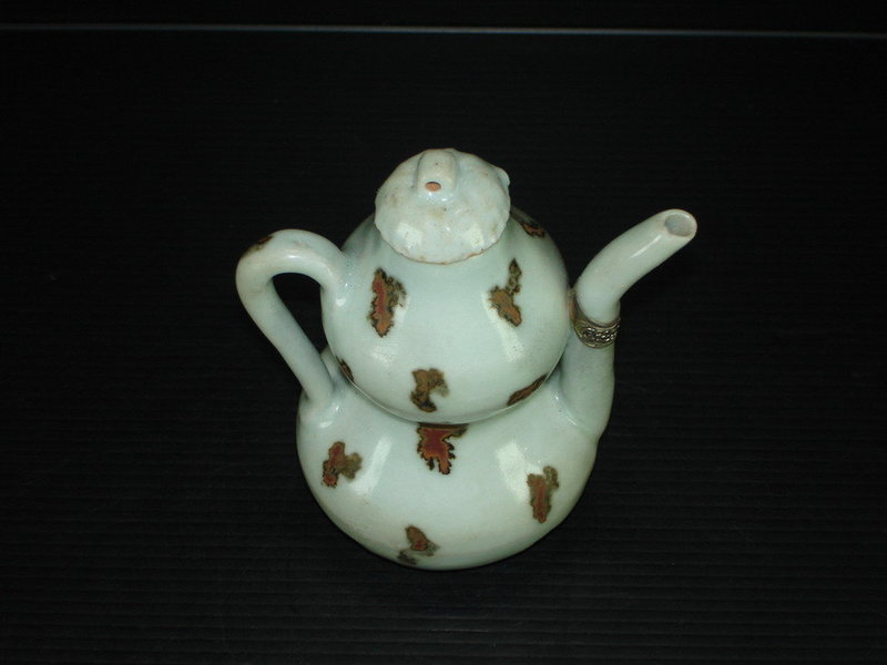 Yuan dynasty iron spot double gourd ewer with cover