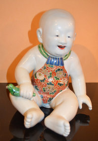 Japanese Satsuma Porcelain Sculpture of a Baby Boy