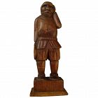 Folk art hand-carved wood statuette of a man