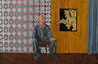 Contemporary American painting of seated man signed
