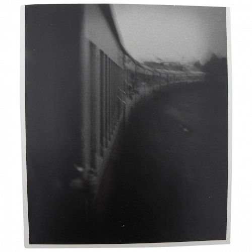 Vintage black and white photo of 1940's style moving train