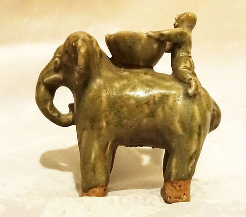 Southeast Asia Pottery Figure of a  Boy on an Elephant