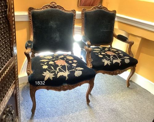 Pair of French Louis XVI Fauteuil chairs in carved walnut